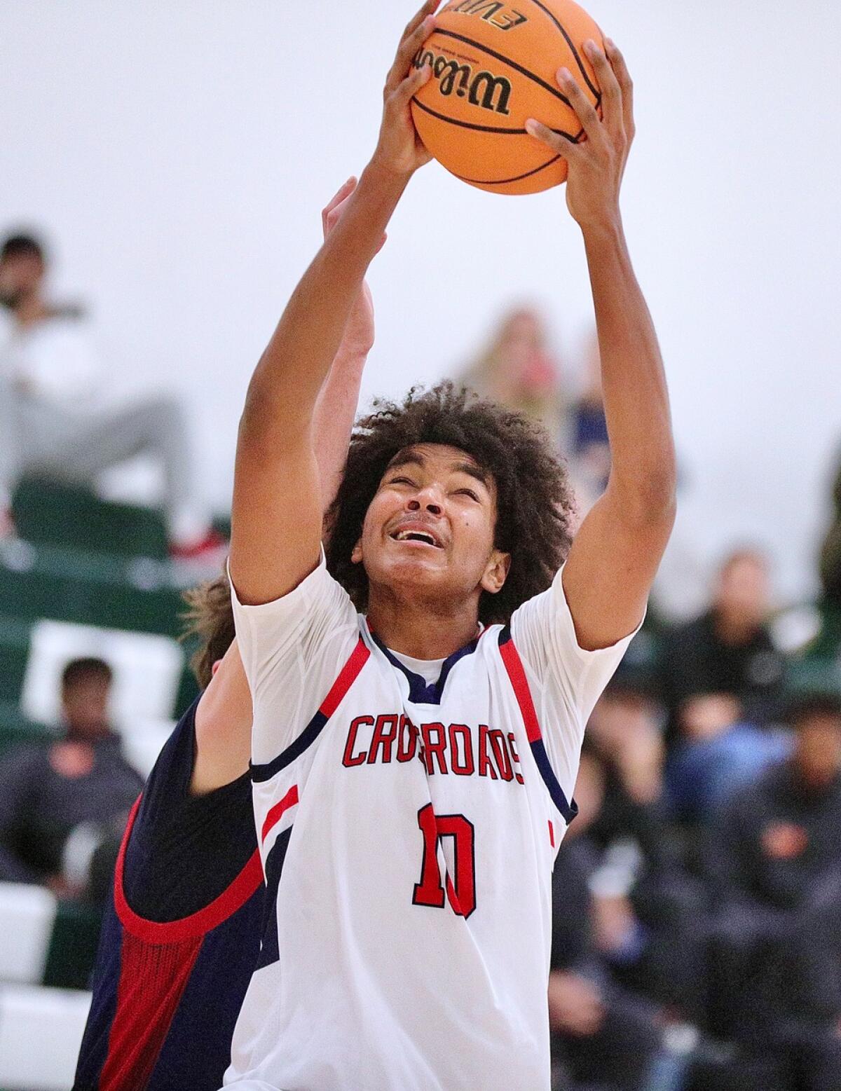 Shalen Sheppard scores 22 points for Crossroads in a Gold Division consolation game.