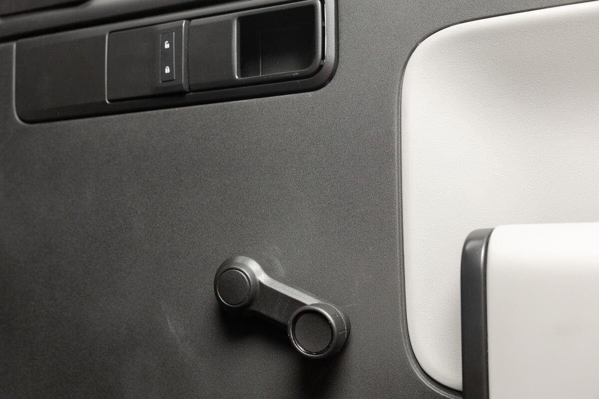 A manual window crank comes standard in the Slate truck.