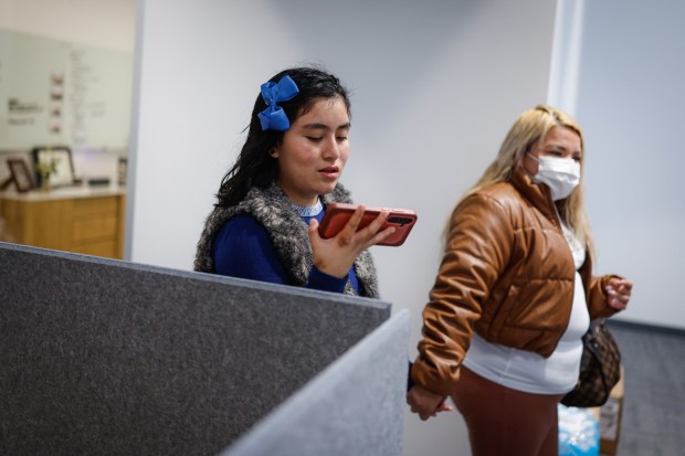 Kathia, who asked to withhold her full name to protect her family's privacy, right, walks with her daughter Briana, 12, at Bay Area Community Health in San Jose, Calif., on Thursday, Oct. 23, 2025. (Shae Hammond/Bay Area News Group)