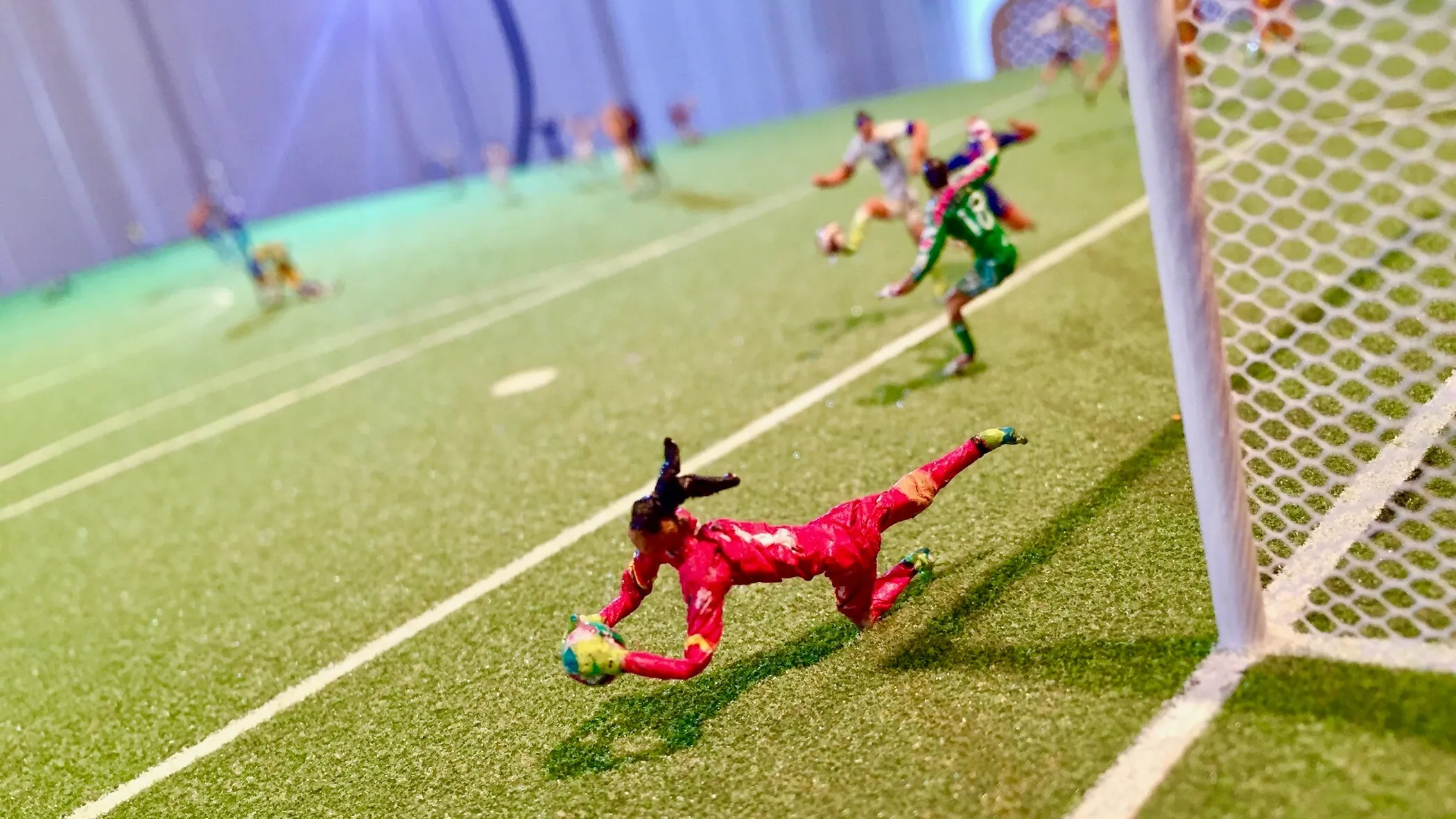 A mini sculpture of a soccer game.