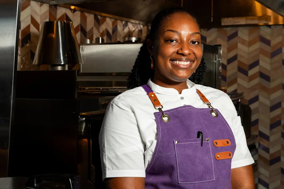 A woman poses for the camera.