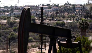 In this May 18, 2021, file photo, homes sit on a hill behind pump jacks operating at the Inglewood Oil Field in Los Angeles. (AP Photo/Jae C. Hong, File)
