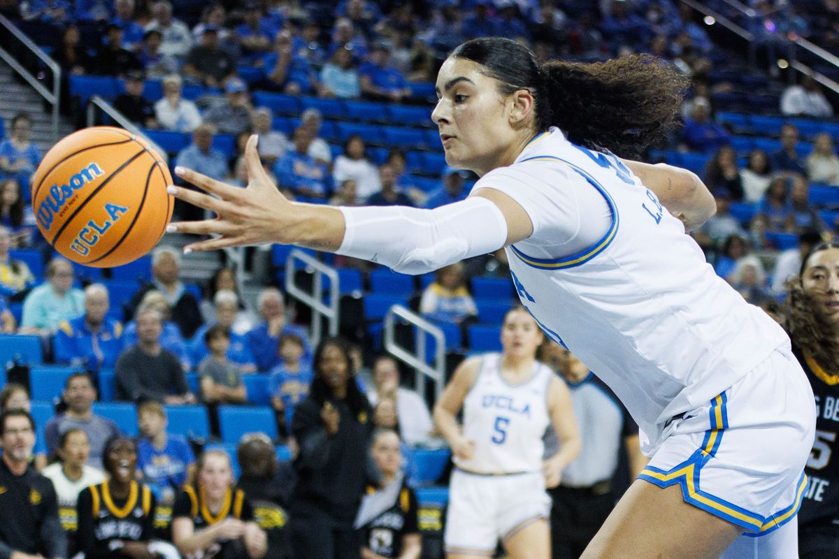 UCLA Bruins center Lauren Betts (51) reaches for the ball during an NCAA basketball game against the Long Beach State, Saturday December 20, 2025 in Los Angeles, Calif.
