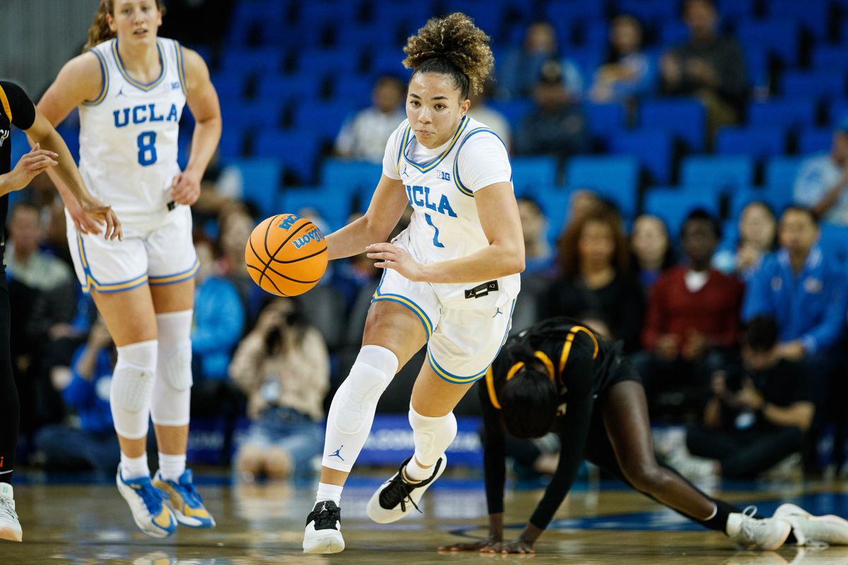 UCLA Bruins guard Kiki Rice (1) dribbles the ball up the court during an NCAA basketball game against Long Beach State, Saturday December 20, 2025 in Los Angeles, Calif.
