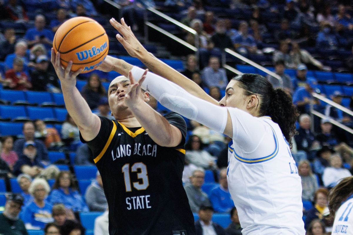 Long Beach State guard Khylee Pepe (13) attempts a layup during an NCAA basketball game against the UCLA Bruins, Saturday December 20, 2025 in Los Angeles, Calif.