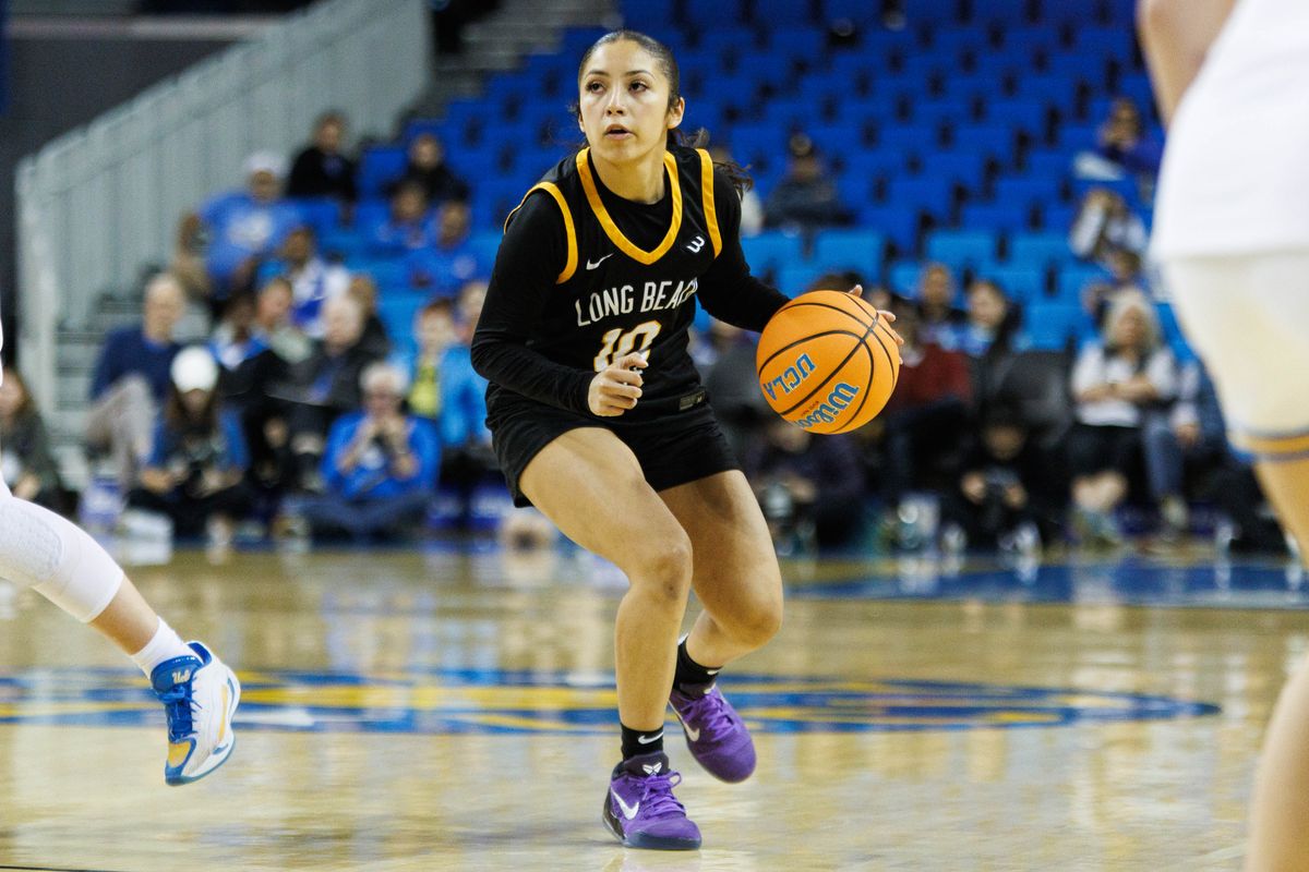Long Beach State guard Christy Reynoso (10) dribbles up with the ball during an NCAA basketball game against the UCLA Bruins, Saturday December 20, 2025 in Los Angeles, Calif.