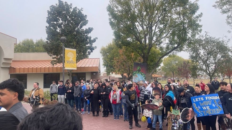 Parents, students, and administrators gathered together for a prayer over BCHS football team before they take off to CIF State Championship at Saddleback College. Familes made posted and cheered on the team as the walked onto the bus. PHOTO: KBFX{p}{/p}