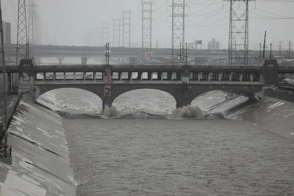 LOS ANGELES, CALIFORNIA – DECEMBER 24: Water levels rise in the LA River during heavy rainfall from the Pineapple Express storm impacting the region during the week of Christmas in Los Angeles, California on December 24, 2025. (Photo by Grace Hie Yoon/Anadolu via Getty Images)