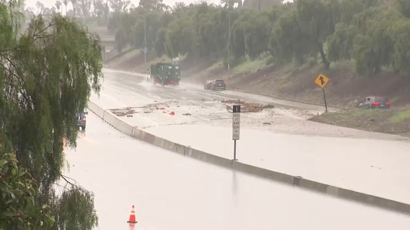 The 5 Freeway in Sun Valley was shut down Wednesday as the lanes became heavily flooded.