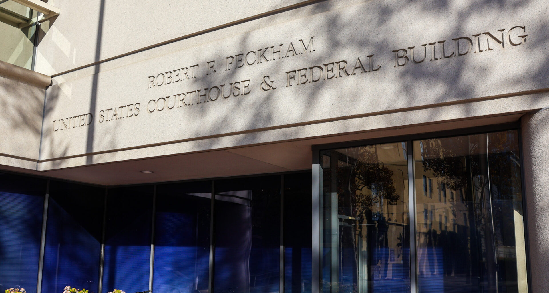 Exterior view of the Robert F. Peckham United States Courthouse & Federal Building with sunlight and shadows on the facade.