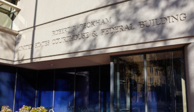 Exterior view of the Robert F. Peckham United States Courthouse & Federal Building with sunlight and shadows on the facade.