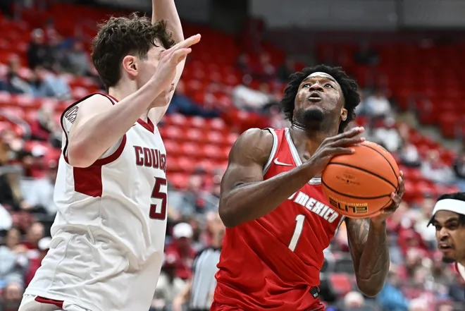 Oct 25, 2025; Pullman, WA, USA; New Mexico Lobos guard Deyton Albury (1) shoots the ball against Washington State Cougars guard Tomas Thrastarson (5) in the second half at Friel Court at Beasley Coliseum.
