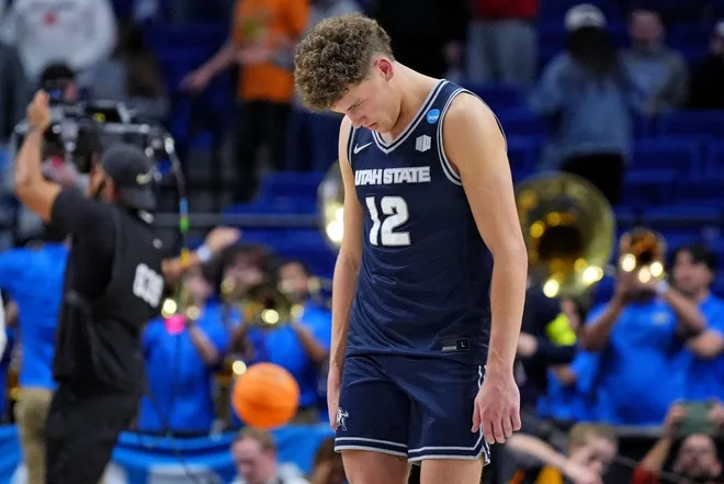 Mar 20, 2025; Lexington, KY, USA; Utah State Aggies guard Mason Falslev (12) reacts after losing to the UCLA Bruins in the first round of the NCAA Tournament at Rupp Arena.