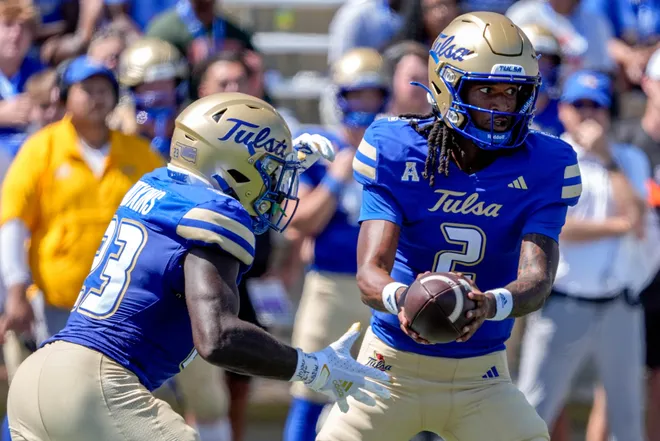 Tulsa quarterback Cardell Williams (2) hands off the ball to Tulsa running back Anthony Watkins (23) in the second half during an NCAA football game between Oklahoma State and Tulsa in Tulsa, Okla., on Saturday, Sept. 14, 2024.