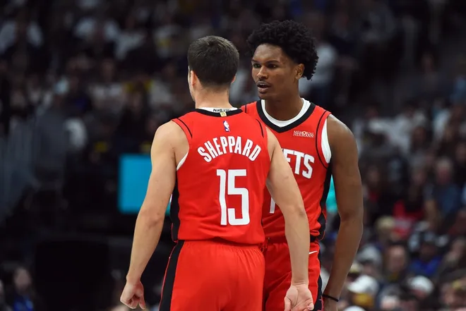 Dec 20, 2025; Denver, Colorado, USA; Houston Rockets guard Amen Thompson (1) and guard Reed Sheppard (15) celebrate after a basket during the second half against the Denver Nuggets at Ball Arena.