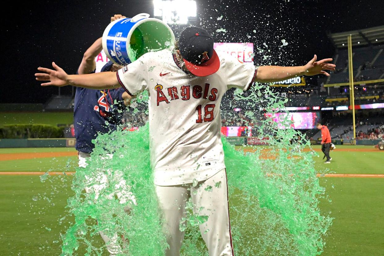 The Angels' Logan O'Hoppe douses Nolan Schanuel with a cooler of sports drink after he earned a walk-off walk.