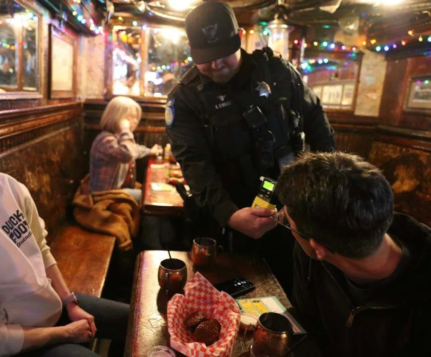 <em>The Sacramento Police department used a breathalyzer to test the BAC of a local bar patron on Dec. 18, 2025. The test is a a part of the “Know Your Limit” campaign./SPD </em>