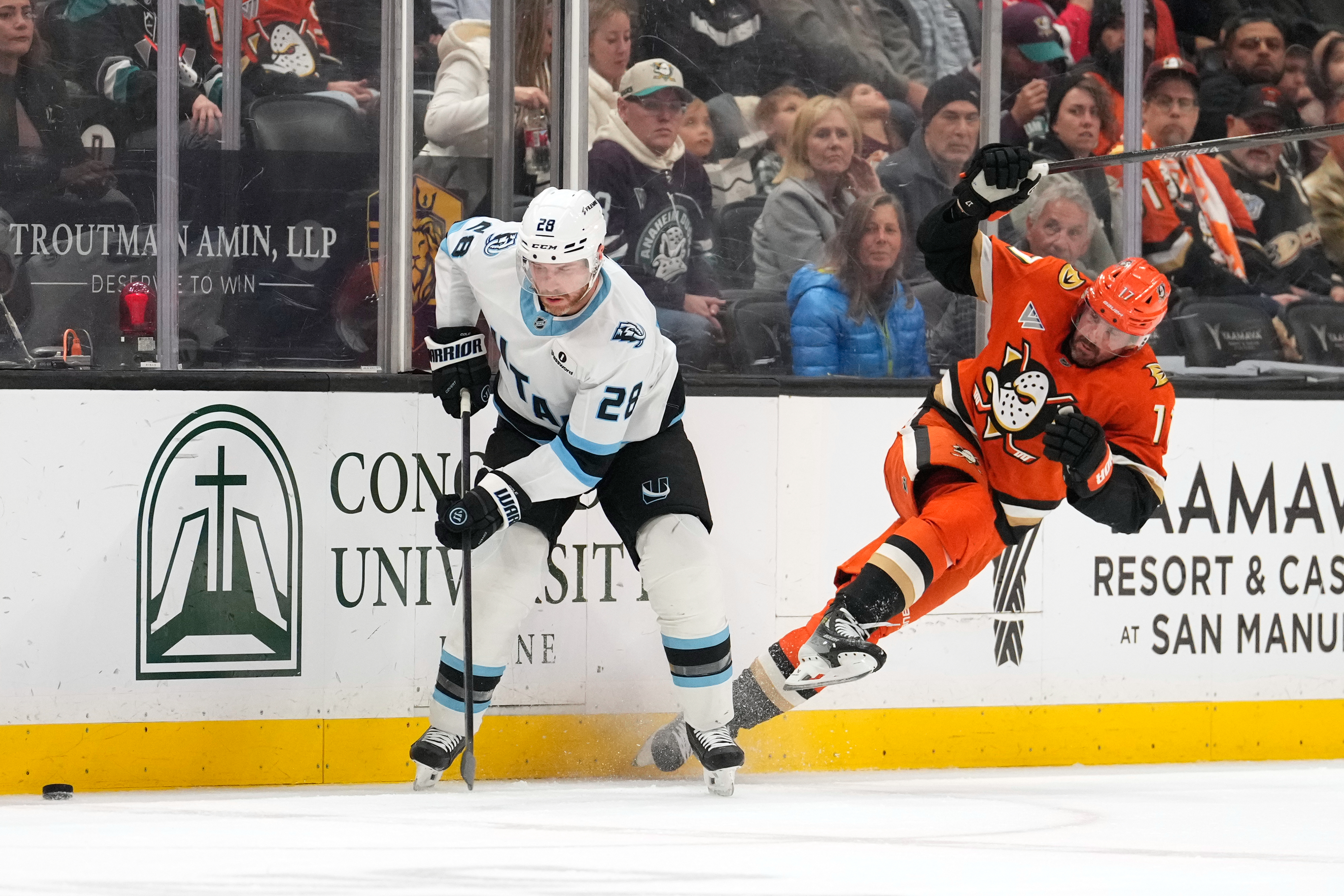 Ducks left wing Alex Killorn right, falls as Utah Mammoth...