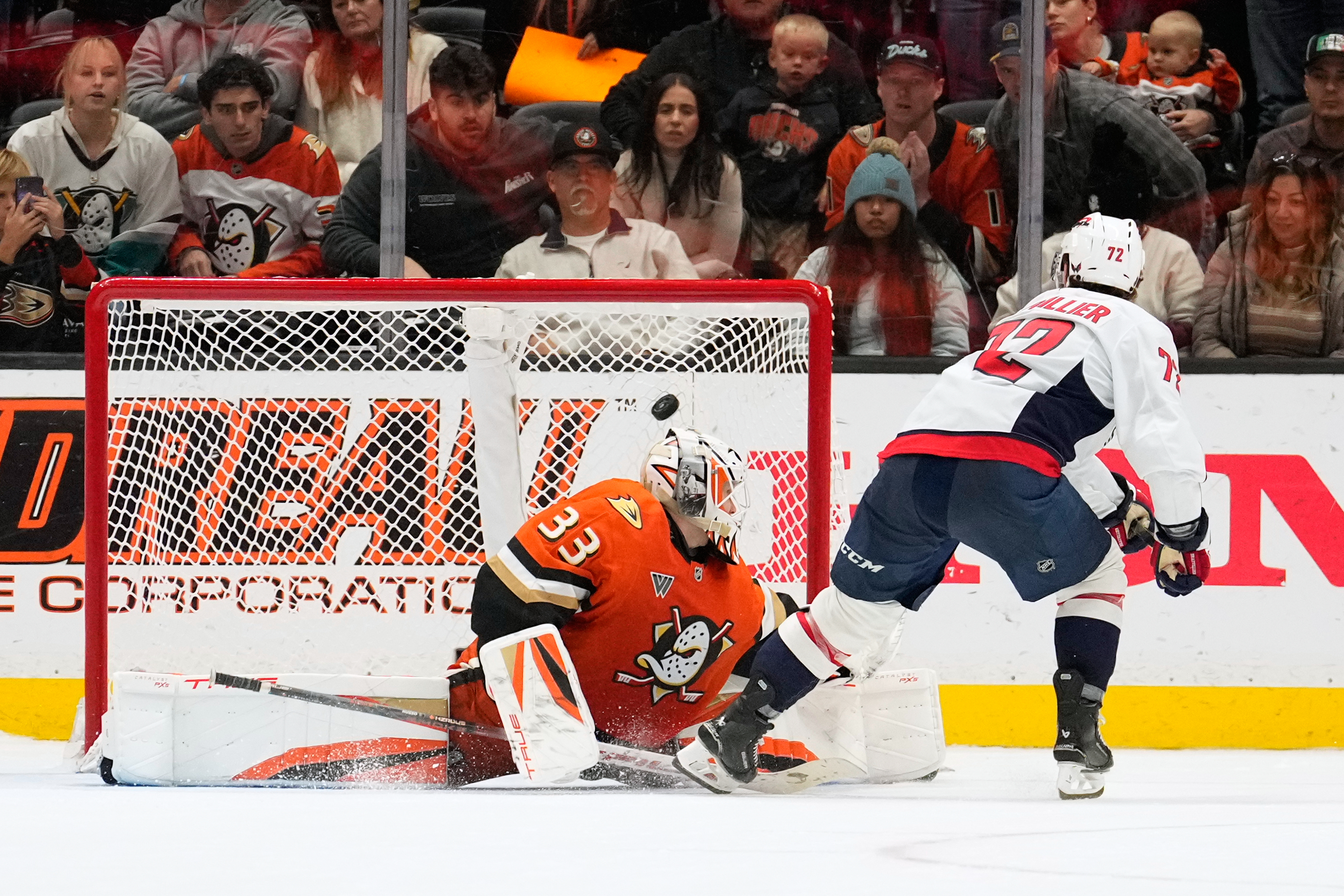 Washington Capitals left wing Anthony Beauvillier, right, scores on Ducks...