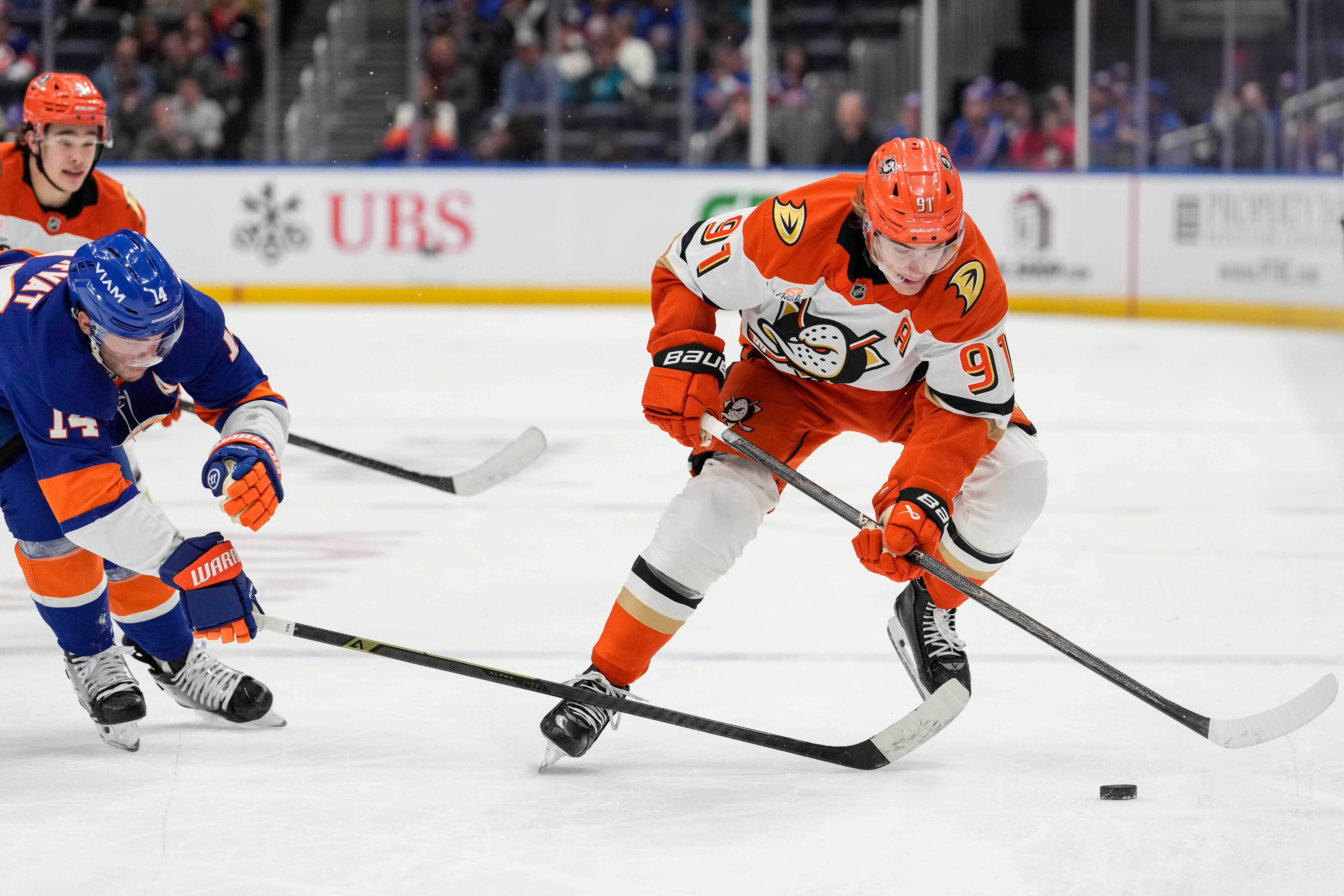 Ducks center Leo Carlsson battles for control of the puck...