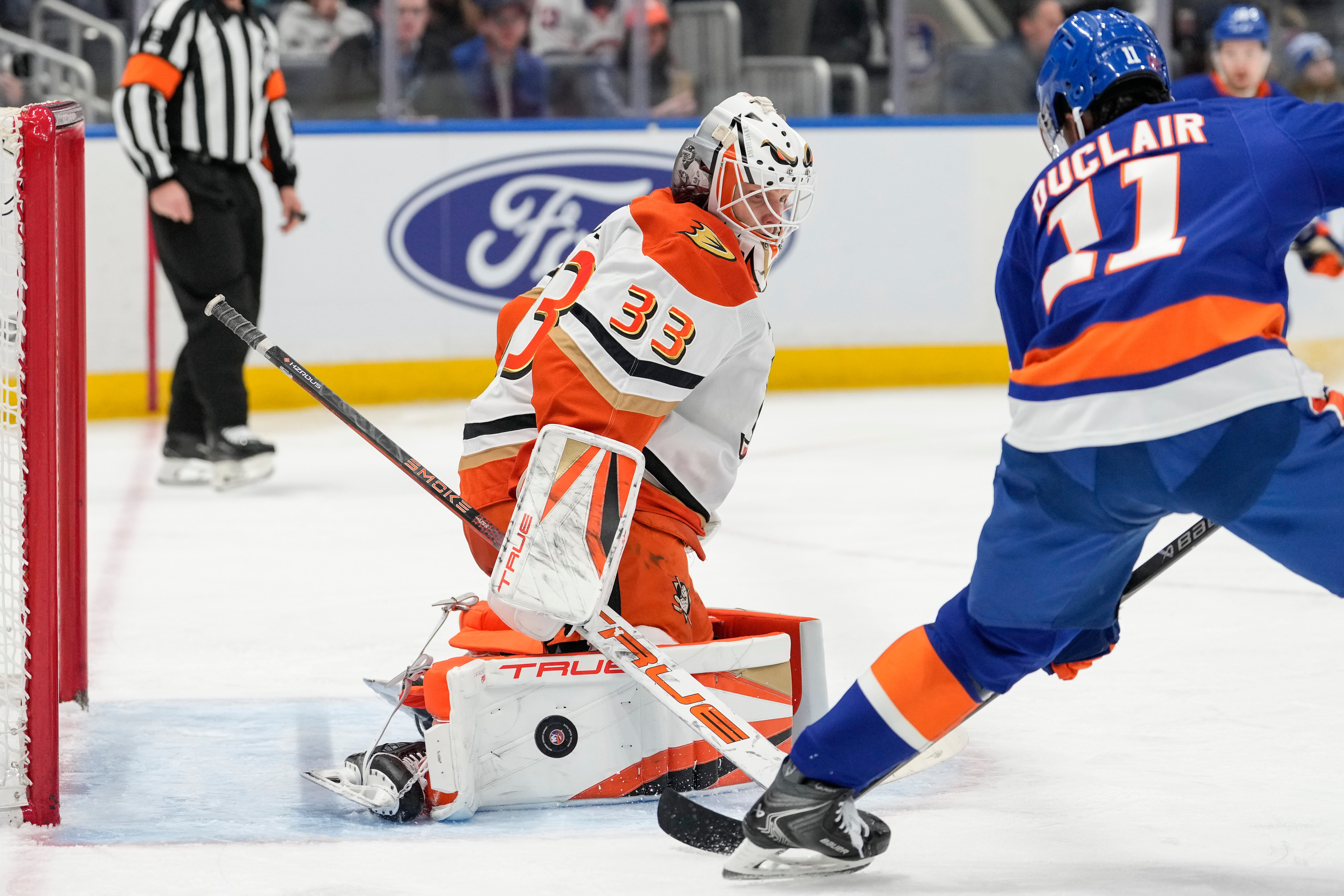 Ducks goaltender Ville Husso protects his net as New York...
