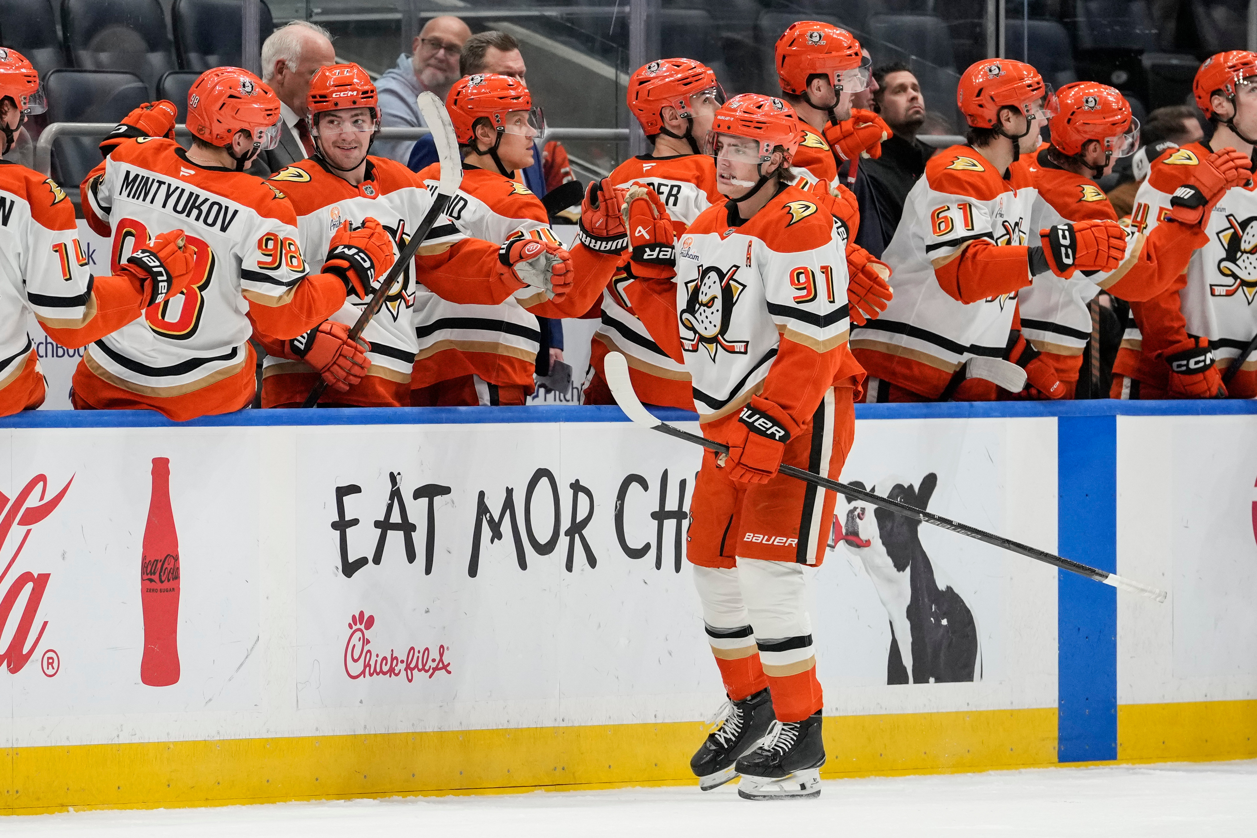 Ducks center Leo Carlsson (91) celebrates with teammates on the...