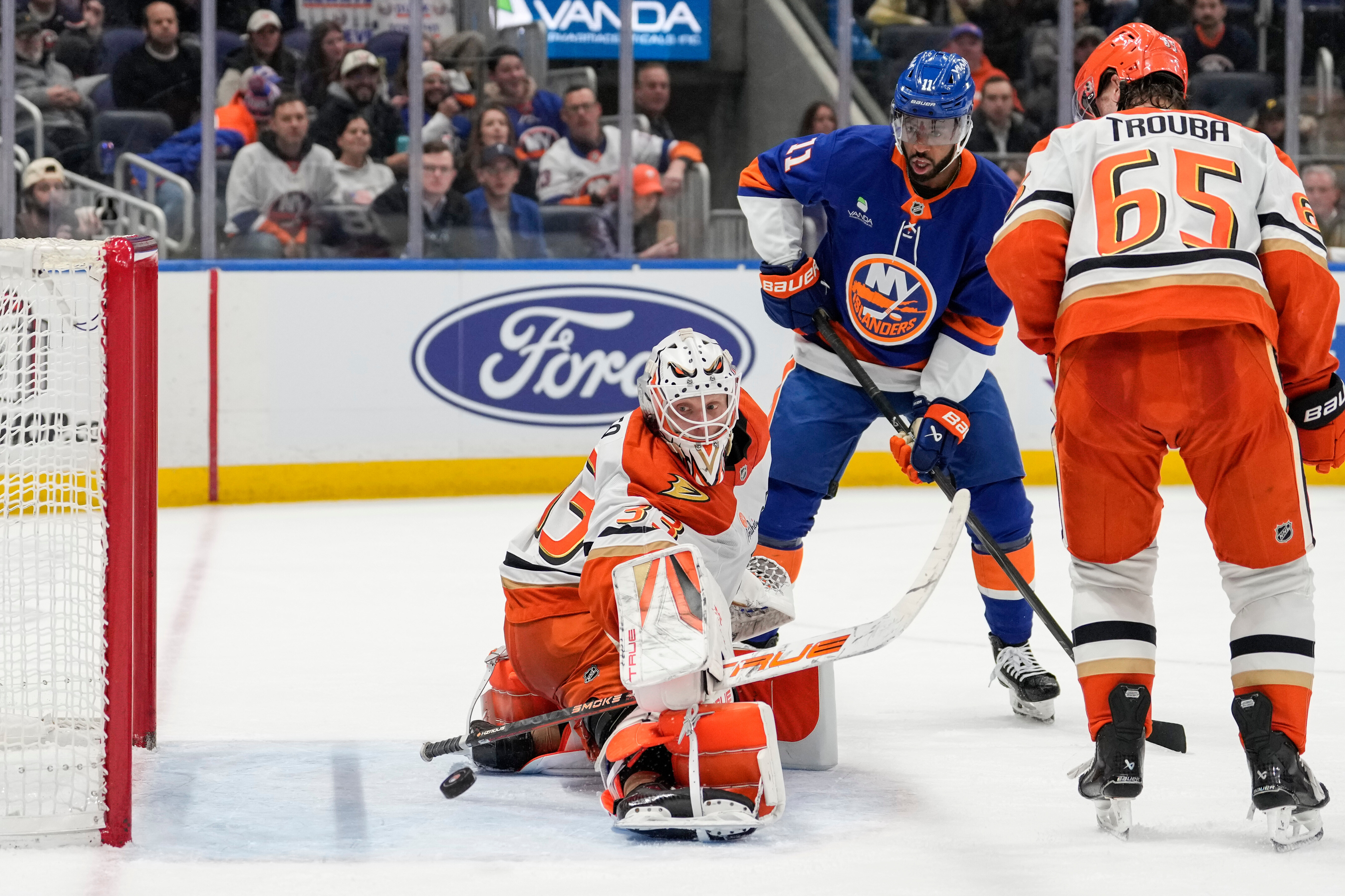 Ducks goaltender Ville Husso (33) tries to deflect a shot...