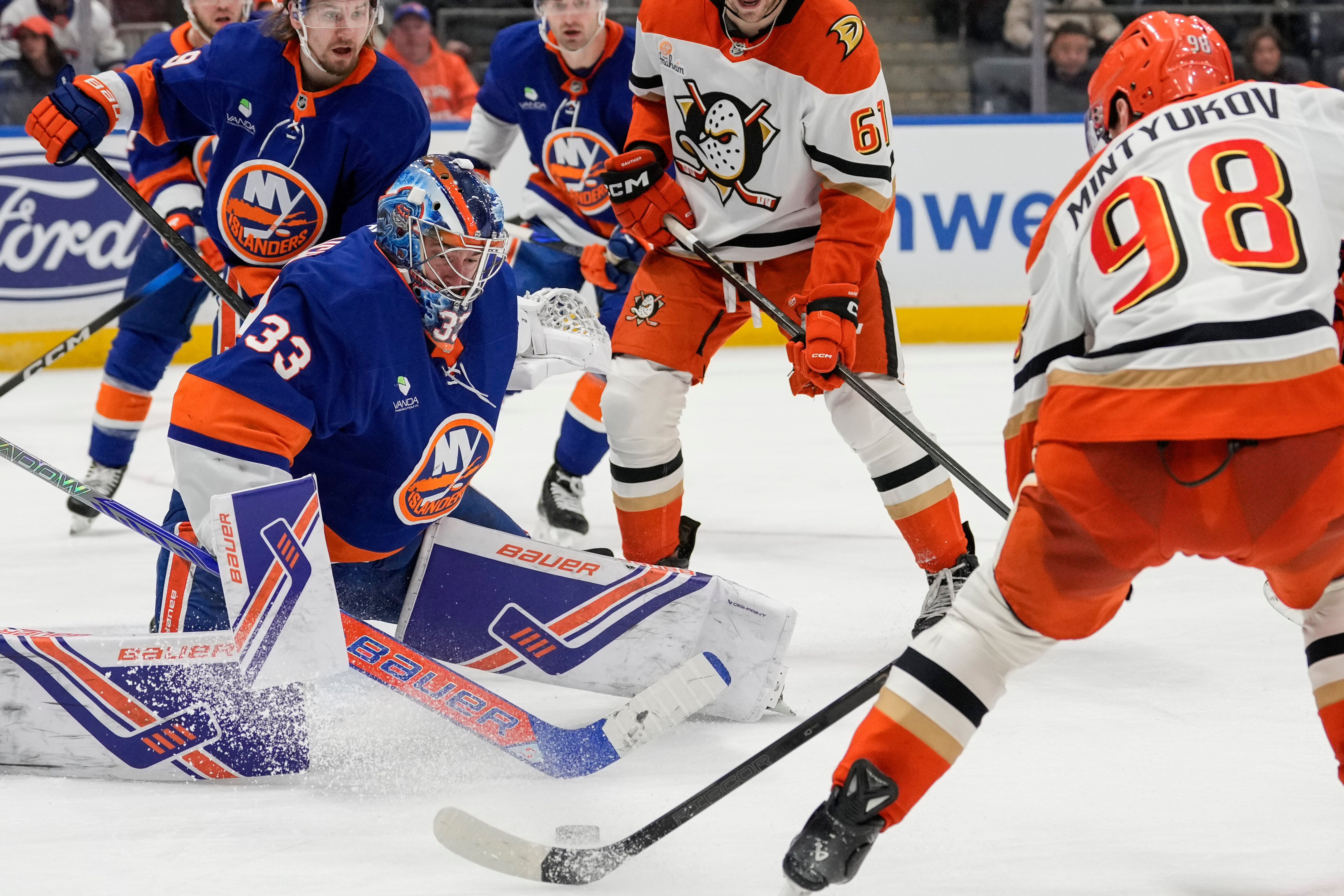 New York Islanders goaltender David Rittich (33) protects his net...