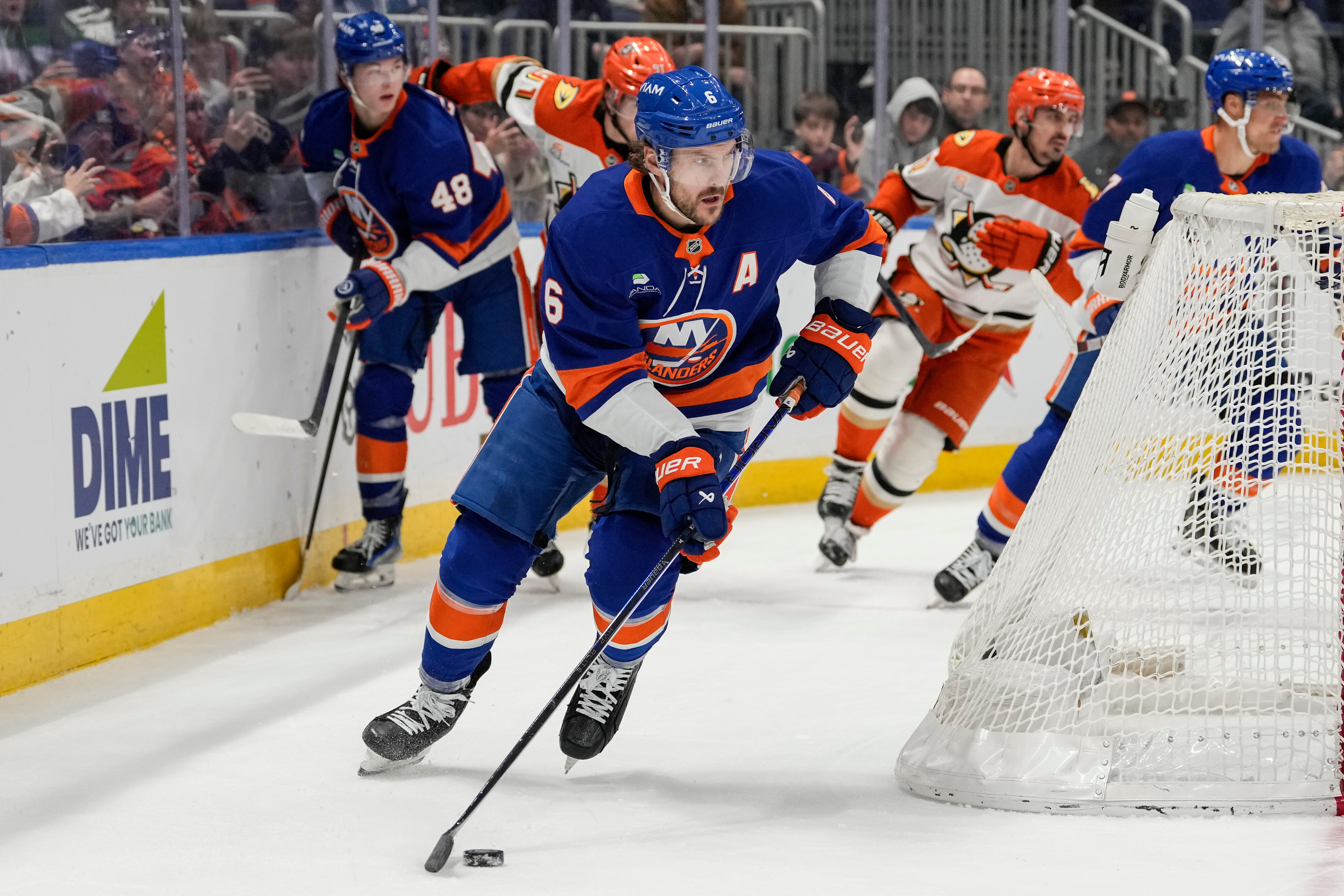 New York Islanders defenseman Ryan Pulock controls the puck during...