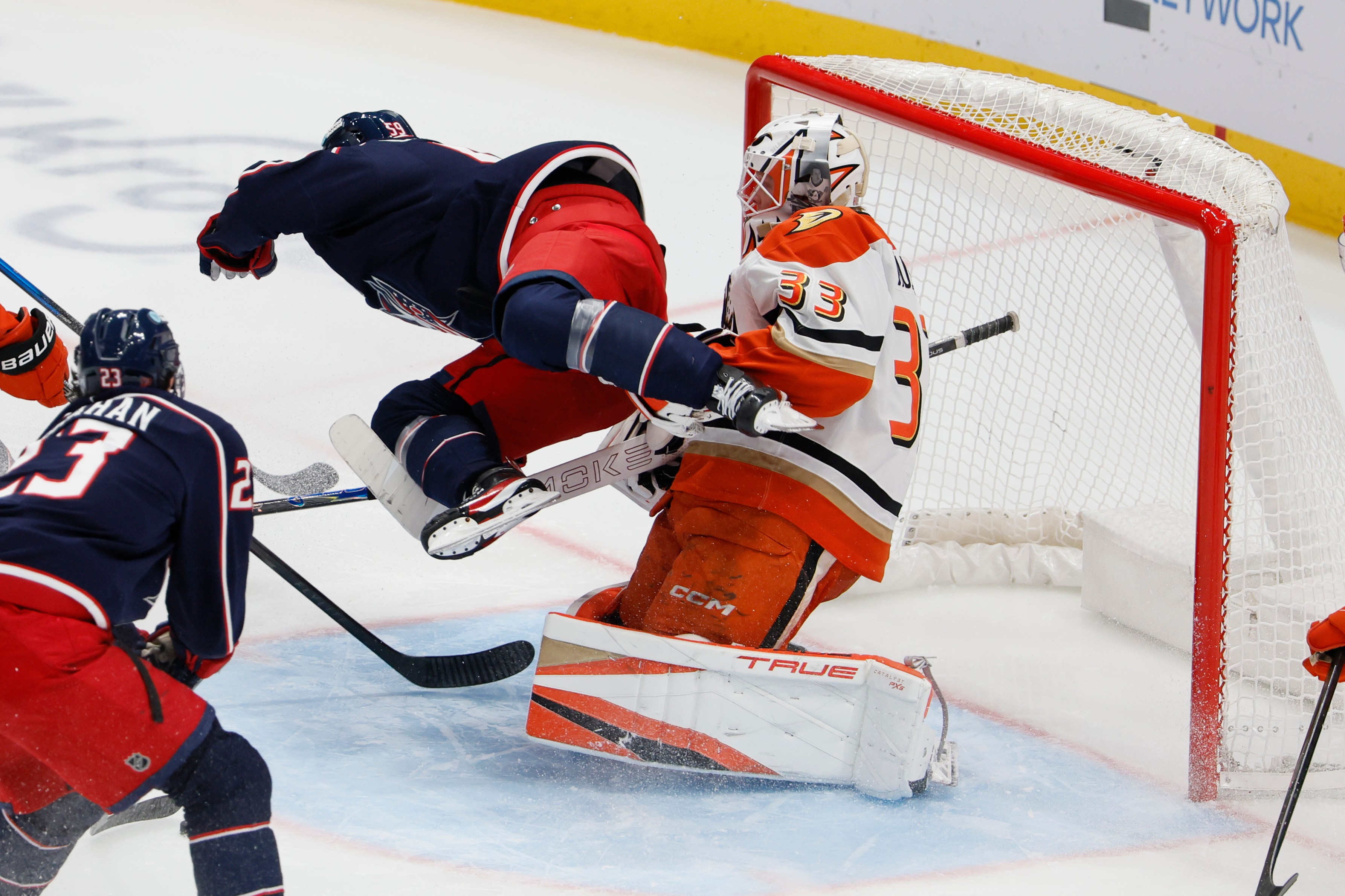 The Columbus Blue Jackets’ Yegor Chinakhov, left, interferes with Ducks...