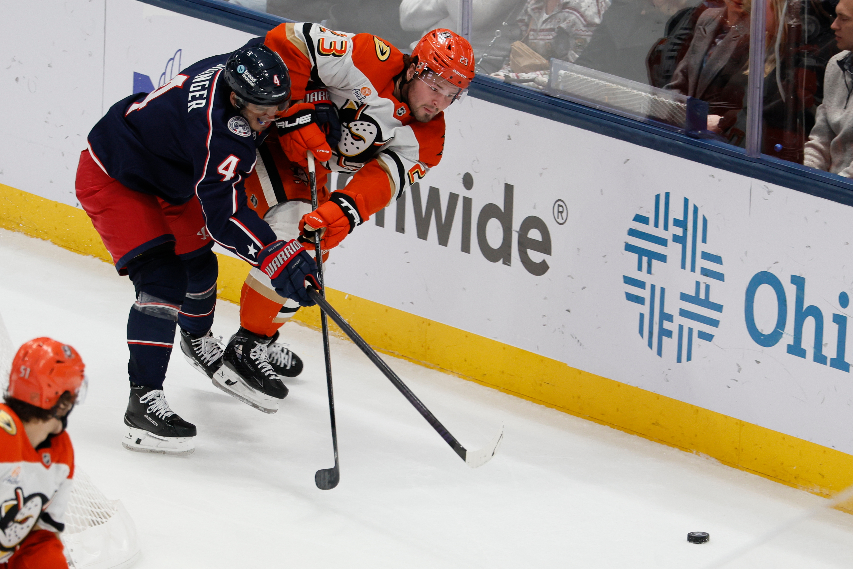 The Columbus Blue Jackets’ Cole Sillinger, left, and the Ducks’...
