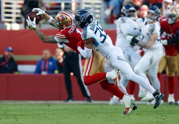 San Francisco 49ers' Ricky Pearsall (1) makes a catch against Tennessee Titans' Darrell Baker Jr. (39) in the third quarter at Levi's Stadium in Santa Clara, Calif., on Sunday, Dec. 14, 2025. (Nhat V. Meyer/Bay Area News Group)