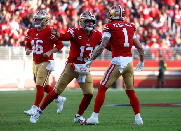 San Francisco 49ers starting quarterback Brock Purdy (13) celebrates his touchdown throw to San Francisco 49ers' Jauan Jennings (15), not shown, with San Francisco 49ers' Ricky Pearsall (1) against the Tennessee Titans in the third quarter at Levi's Stadium in Santa Clara, Calif., on Sunday, Dec. 14, 2025. (Nhat V. Meyer/Bay Area News Group)