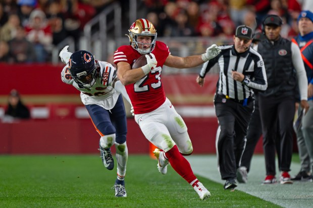 San Francisco 49ers' Christian McCaffrey (23) runs for yardage against the Chicago Bears in the first quarter of their NFL game at Levi's Stadium in Santa Clara, Calif., on Sunday, Dec. 28, 2025. (Jose Carlos Fajardo/Bay Area News Group)