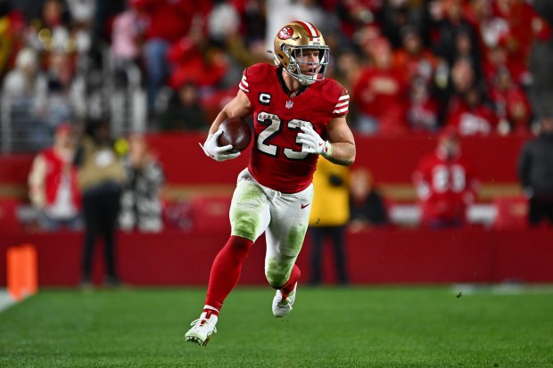 San Francisco 49ers' Christian McCaffrey (23) runs with the ball against the Chicago Bears in the fourth quarter of their NFL game at Levi's Stadium in Santa Clara, Calif., on Sunday, Dec. 28, 2025. The San Francisco 49ers defeated the Chicago Bears 42-38. (Jose Carlos Fajardo/Bay Area News Group)