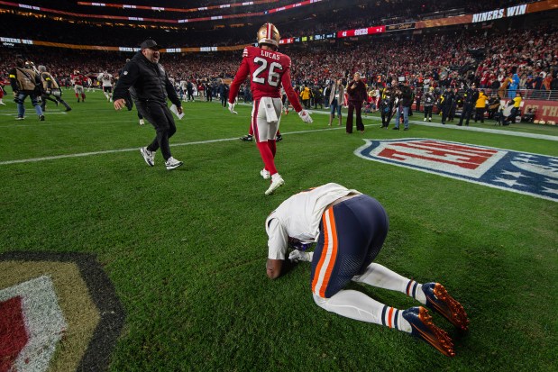 Chicago Bears' Luther Burden III (10) drops to the ground as San Francisco 49ers' Chase Lucas (26) walks away after their NFL game at Levi's Stadium in Santa Clara, Calif., on Sunday, Dec. 28, 2025. The San Francisco 49ers defeated the Chicago Bears 42-38. (Jose Carlos Fajardo/Bay Area News Group)