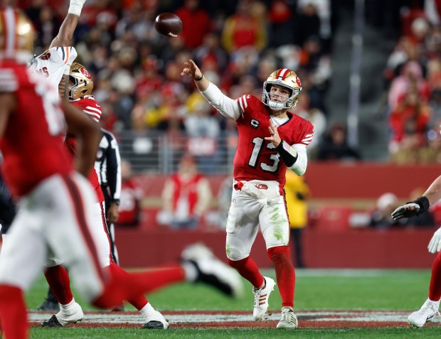 San Francisco 49ers starting quarterback Brock Purdy (13) throws a pass for a touchdown to San Francisco 49ers' Jauan Jennings (15) against the Chicago Bears in the fourth quarter at Levi's Stadium in Santa Clara, Calif., on Sunday, Dec. 28, 2025. (Nhat V. Meyer/Bay Area News Group)