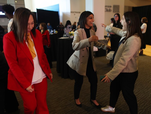 Bay Area Host Committee President and CEO Zaileen Janmohamed, center, greets guests at the BAHC Speaker Series and Impact Award event at Levi's Stadium on Thursday, Dec. 11, 2025, in Santa Clara, Calif. (Aric Crabb/Bay Area News Group)