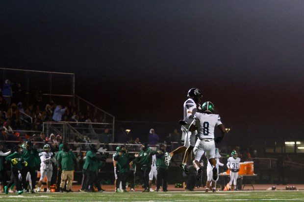 El Cerrito's Tyson Williams (2) and El Cerrito's Keiyev Leslie (8) celebrate after winning against Menlo-Atherton during the NorCal Division 4-A championship at Menlo-Atherton High School in Atherton, Calif., on Saturday, Dec. 6, 2025. (Shae Hammond/Bay Area News Group)