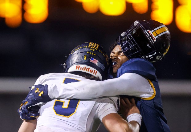 Gridley's Eli Punzo (5) runs with the ball while Lincoln's Michael Whitelaw (7) helmet come off in the fourth quarter during the CIF NorCal championship game at Lincoln High School in San Jose, Calif., on Friday, Dec. 5, 2025. (Shae Hammond/Bay Area News Group)