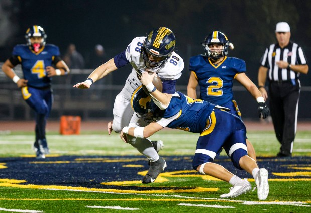 Lincoln's Lucas Martinez (11) tackles Gridley's Jace Griggs (88) in the fourth quarter during the CIF NorCal championship game at Lincoln High School in San Jose, Calif., on Friday, Dec. 5, 2025. (Shae Hammond/Bay Area News Group)