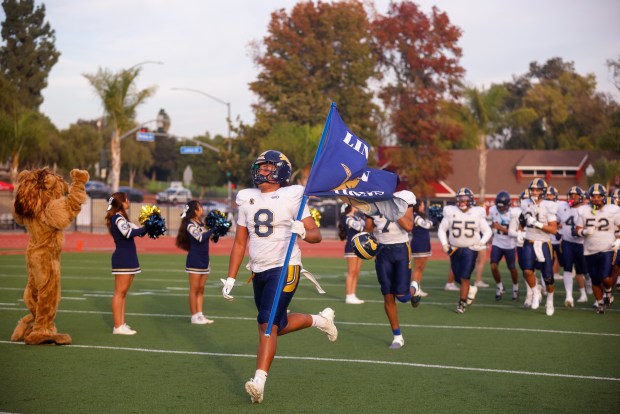 Lincoln runs on the field before the game against Valley Center during Division 6-AA state football championship game at Fullerton Union High School District Stadium in Fullerton, Calif., on Friday, Dec. 12, 2025. (Shae Hammond/Bay Area News Group)