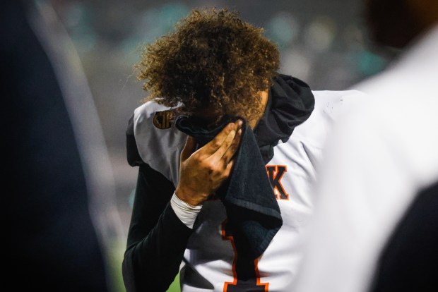 McClymonds' Berell Staples (1) covers his face after McClymonds loses against Kennedy-Delano during the Division 3-A state championship football game at Fullerton Union High School District Stadium in Fullerton, Calif., on Saturday, Dec. 13, 2025. (Shae Hammond/Bay Area News Group)