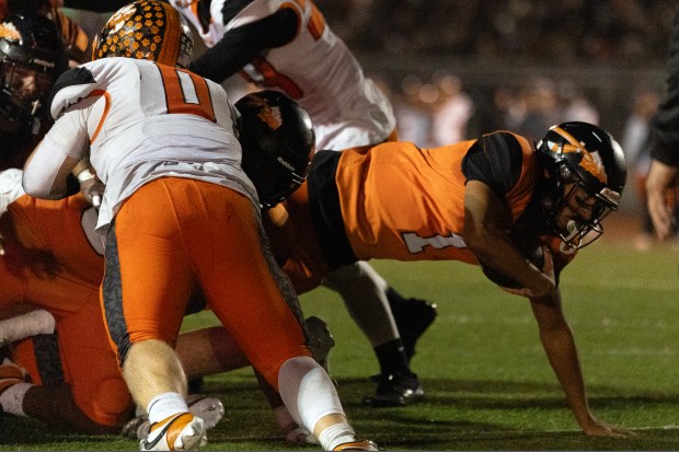 McClymonds quarterback Berell Staples (1) drives into the end zone for a touchdown against Roseville during the second quarter of a CIF NorCal Division 3-A high school football championship game, Saturday, Dec. 6, 2025 in Oakland, Calif. (D. Ross Cameron for the Bay Area News Group)