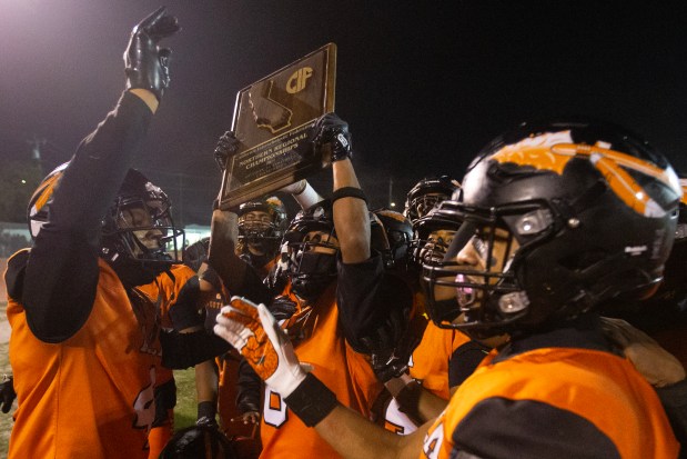 McClymonds players celebrate their 42-35 victory over Roseville in a CIF NorCal Division 3-A high school football championship game, Saturday, Dec. 6, 2025 in Oakland, Calif. (D. Ross Cameron for the Bay Area News Group)