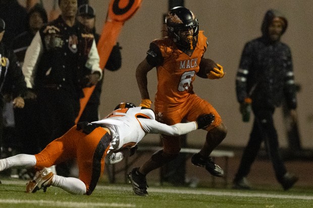 McClymonds running back Jessie King Jr. (5) breaks a big gainer around left end against Roseville during the fourth quarter of a CIF NorCal Division 3-A high school football championship game, Saturday, Dec. 6, 2025 in Oakland, Calif. (D. Ross Cameron for the Bay Area News Group)