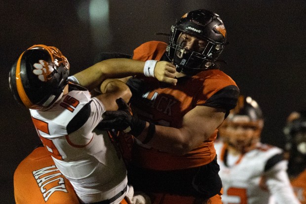 McClymonds lineman Koi Taiese (51) knocks down Roseville quarterback Mason Susnara (16) during the second quarter of a CIF NorCal Division 3-A high school football championship game, Saturday, Dec. 6, 2025 in Oakland, Calif. (D. Ross Cameron for the Bay Area News Group)