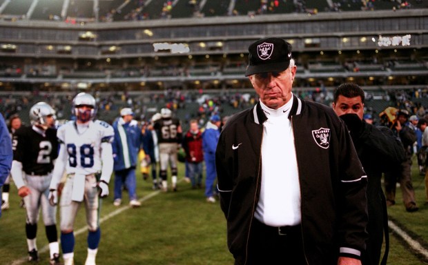 PHOTO BY GARY REYES A somber Mike White walks off the football field in the final game of the 1996 season. The Raiders lost, 28-21, against the Seattle Seahawks.