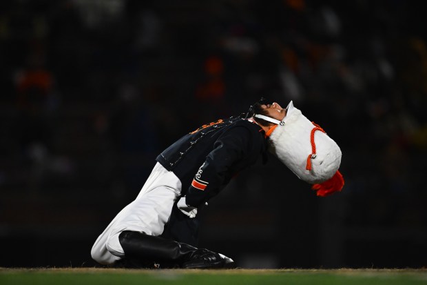 Pittsburg Marching Show Band drum major Santiago De La Rosa bends backwards before the start of their CIF NorCal Division 1-A Championship game at Pittsburg High School in Pittsburg, Calif., on Saturday, Dec. 6, 2025. Central East defeats Pittsburg 55-36. (Jose Carlos Fajardo/Bay Area News Group)
