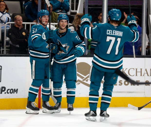 San Jose Sharks' Collin Graf (51) celebrates his goal with San Jose Sharks' William Eklund (72) and San Jose Sharks' Macklin Celebrini (71) against the Boston Bruins in the third period at the SAP Center in San Jose, Calif., on Sunday, Nov. 23, 2025. (Nhat V. Meyer/Bay Area News Group)